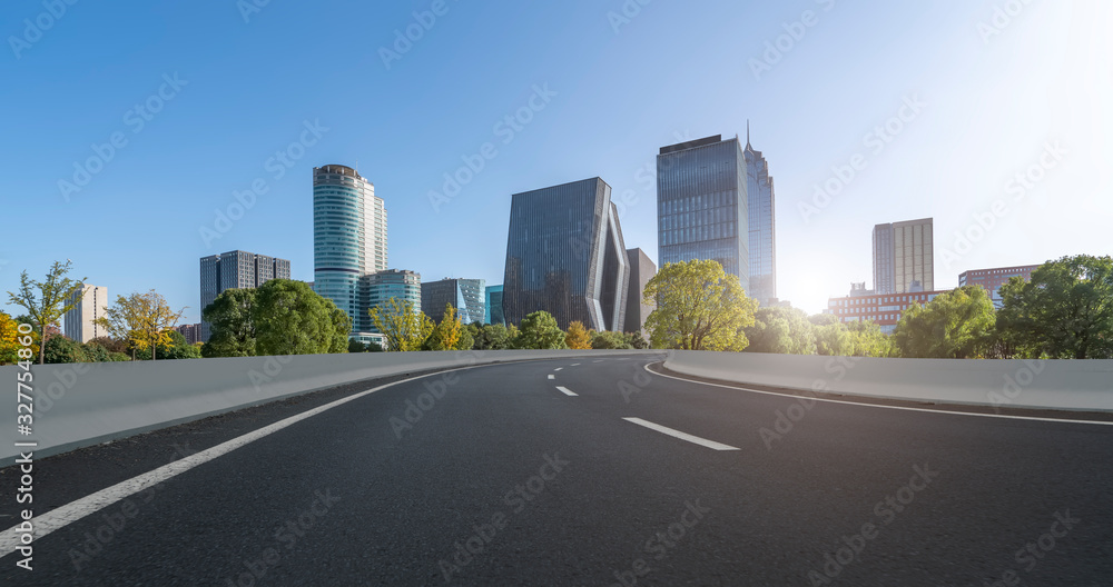 Asphalt road and urban architectural landscape of Ningbo..