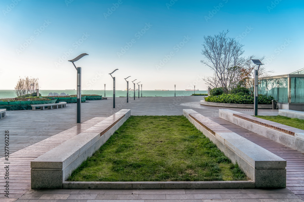 Floor tiles and seascape of city square..