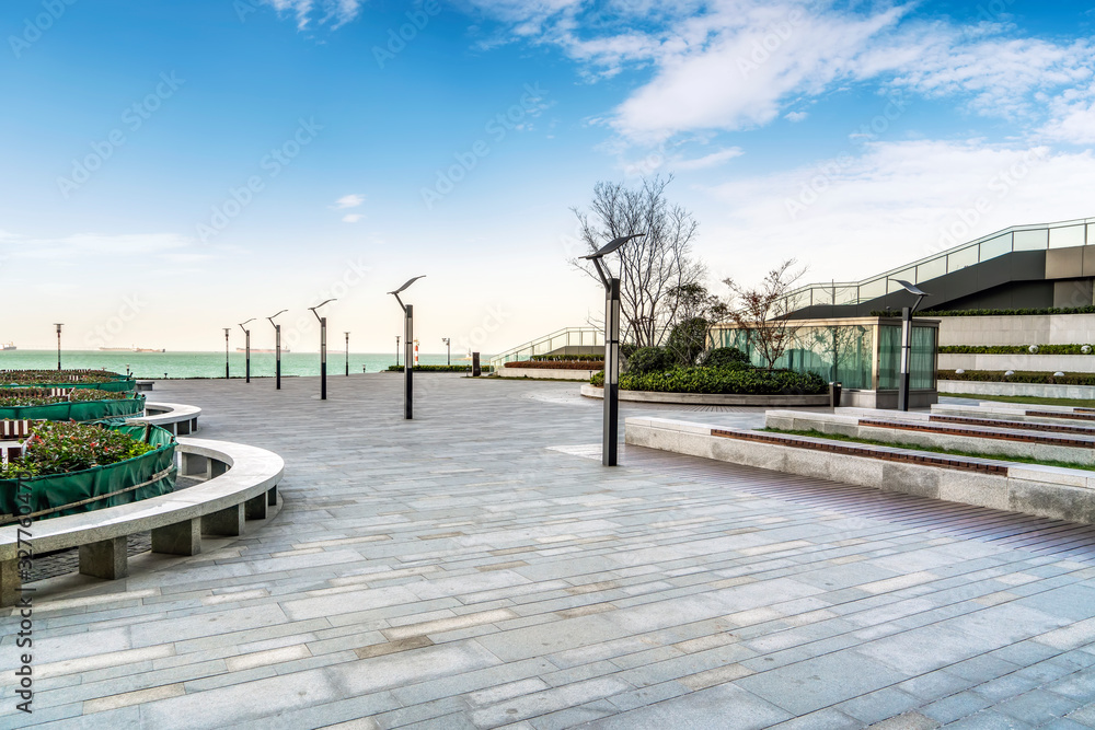 Floor tiles and seascape of city square..