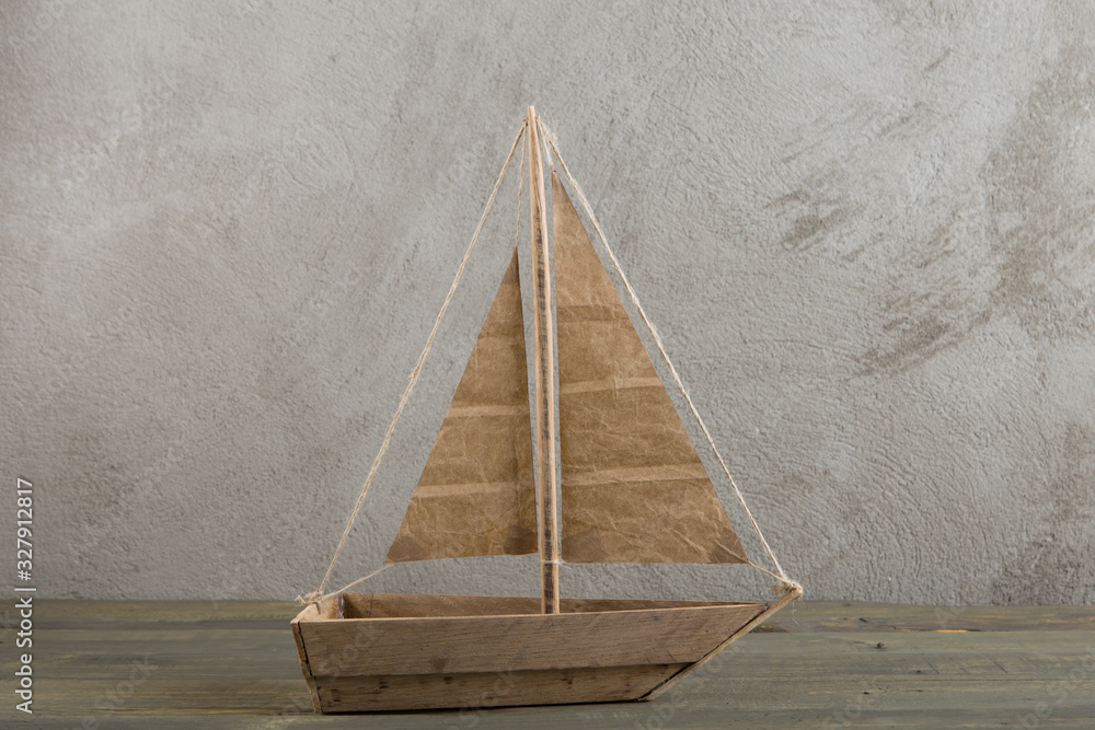 Travel and adventure creative concept - toy wooden boat