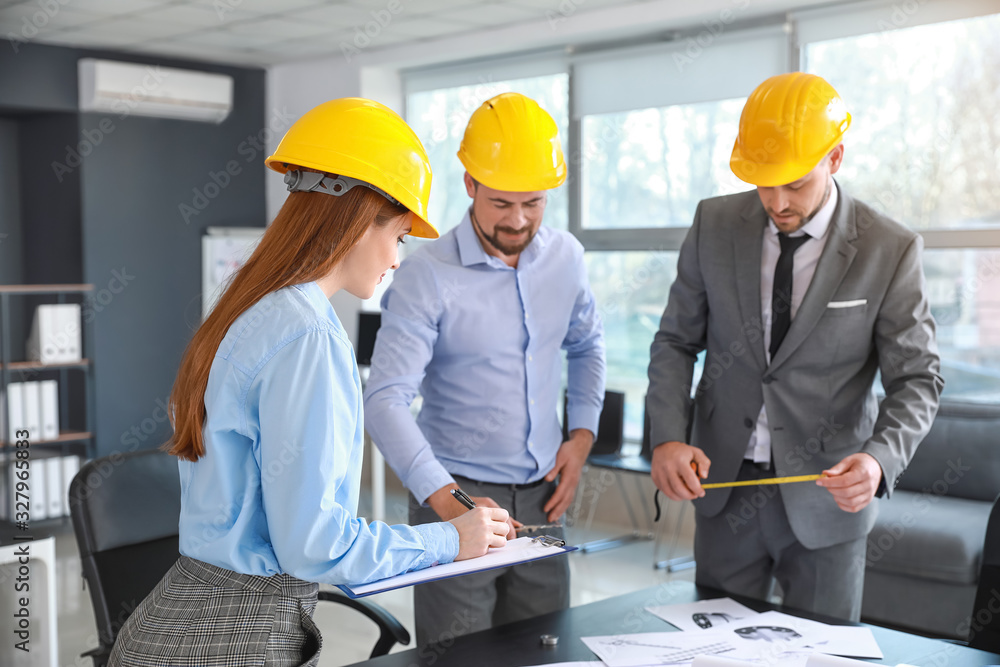 Group of engineers working in office