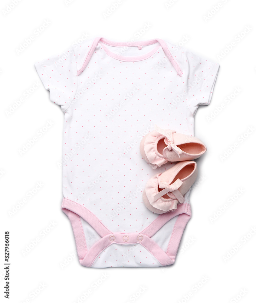 Baby clothes with booties on white background