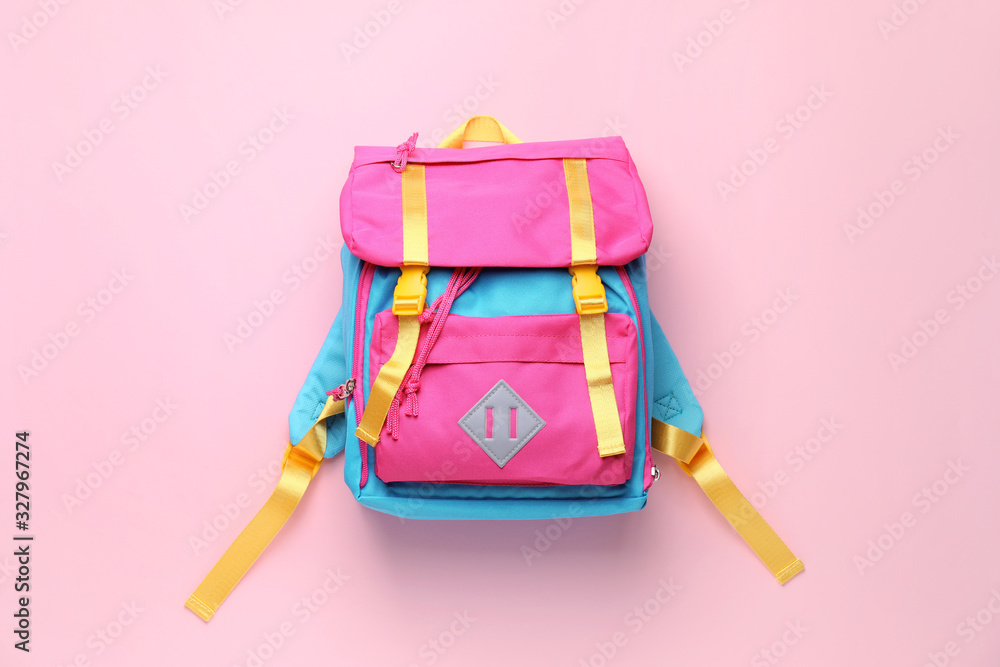 School backpack on color background