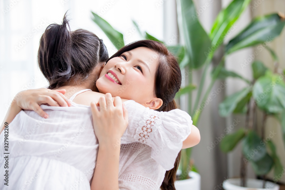 Daughter give mom a hug