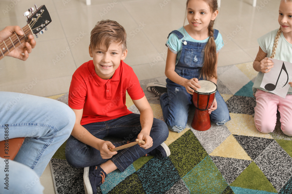 Cute little children at music school