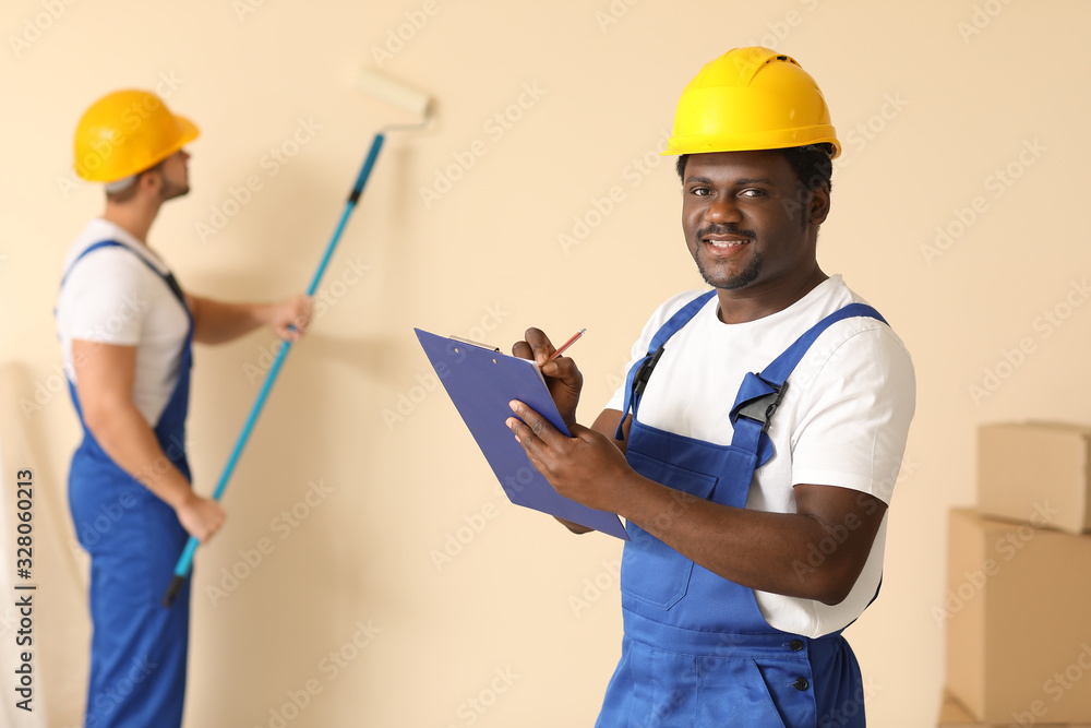 Painters doing repair in room