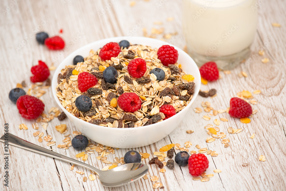 Breakfast Served in the morning with corn flakes Whole grains and raisins with milk in cups and Stra