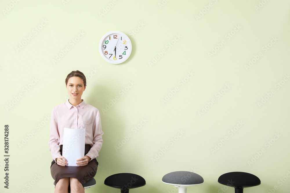 Young woman waiting for job interview indoors