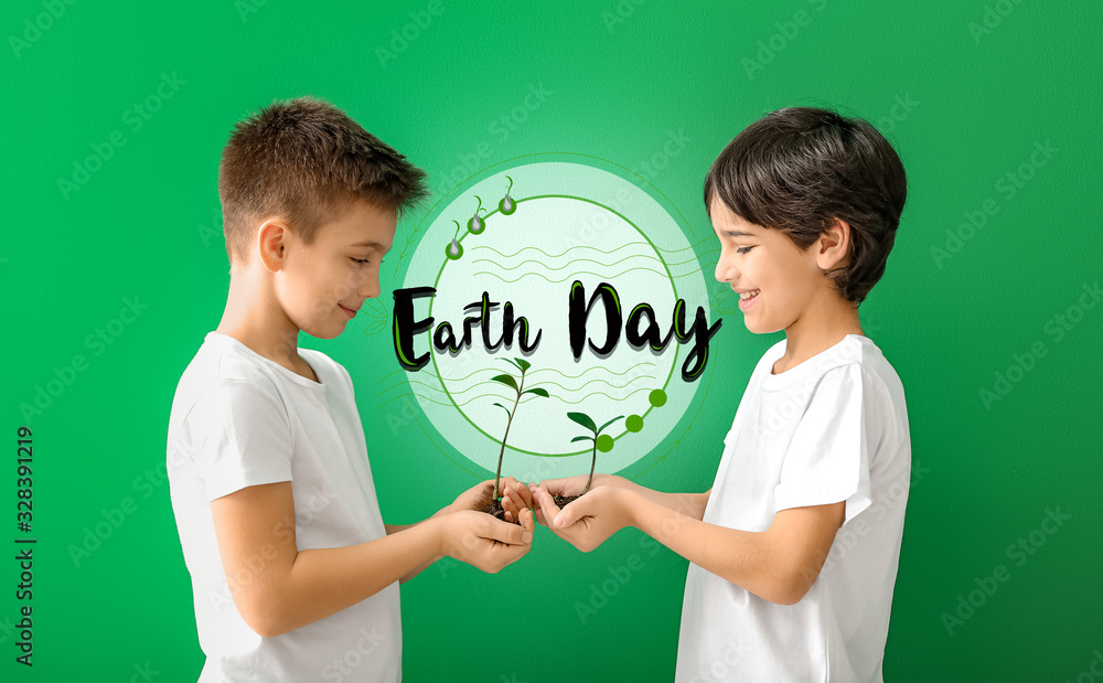 Little children with plants and soil on color background. Earth Day celebration