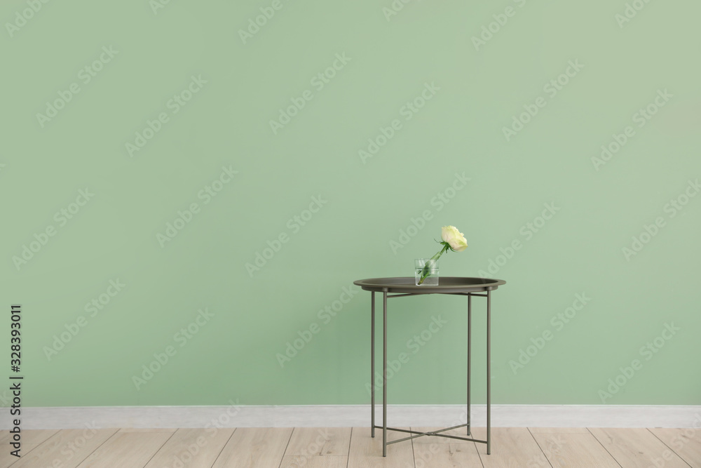 Modern table near color wall