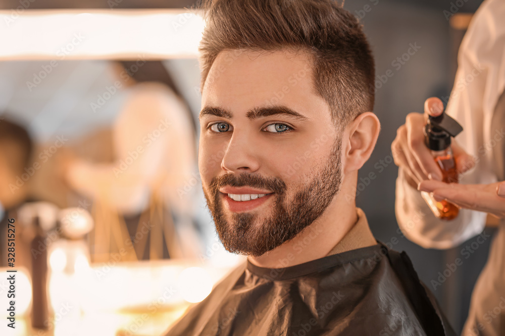 Hairdresser working with client in salon