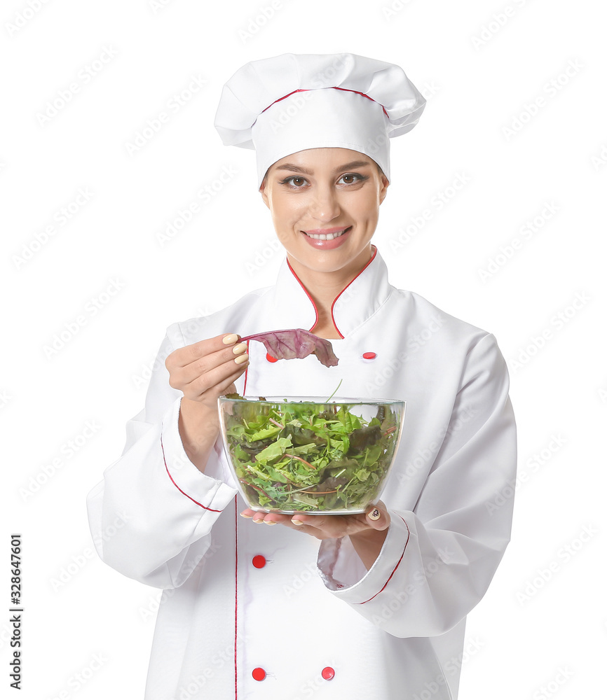 Beautiful female chef with salad on white background