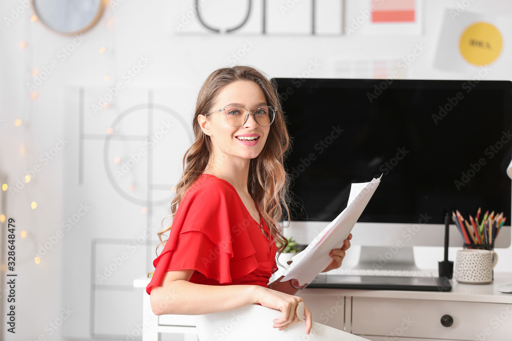 Portrait of female interior designer in office