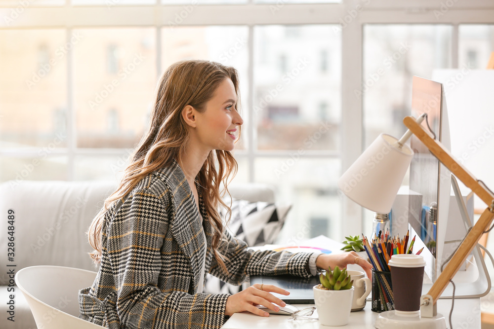 Female interior designer working in office