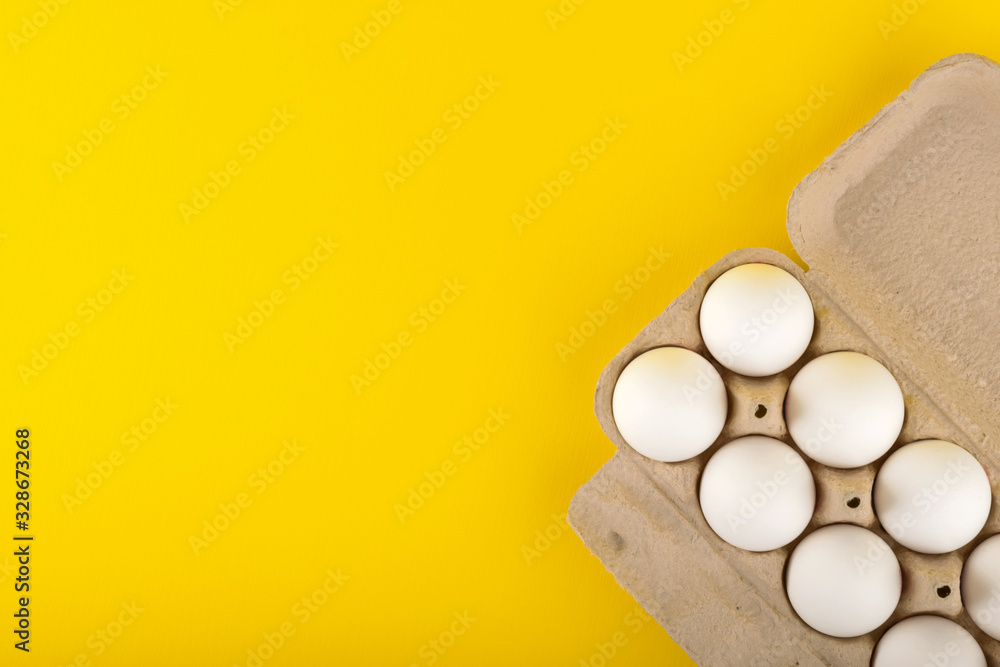 eggs on yellow background top view