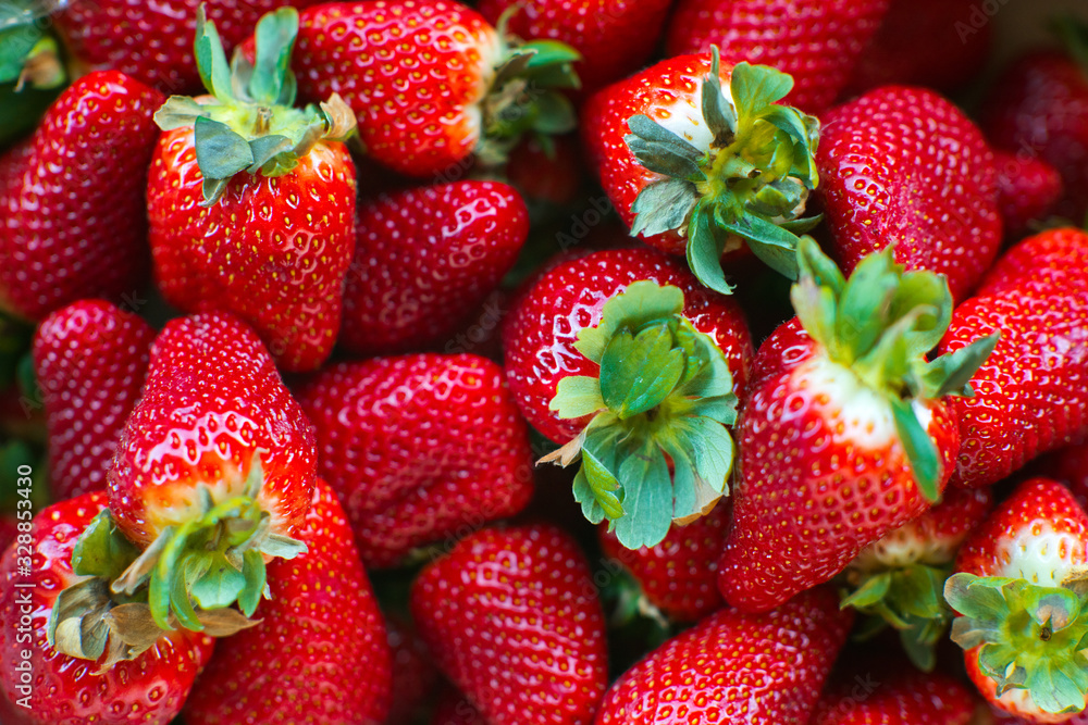 Strawberry. Fresh and ripe organic Strawberries Background, Vegetarian healthy food backdrop. Close-