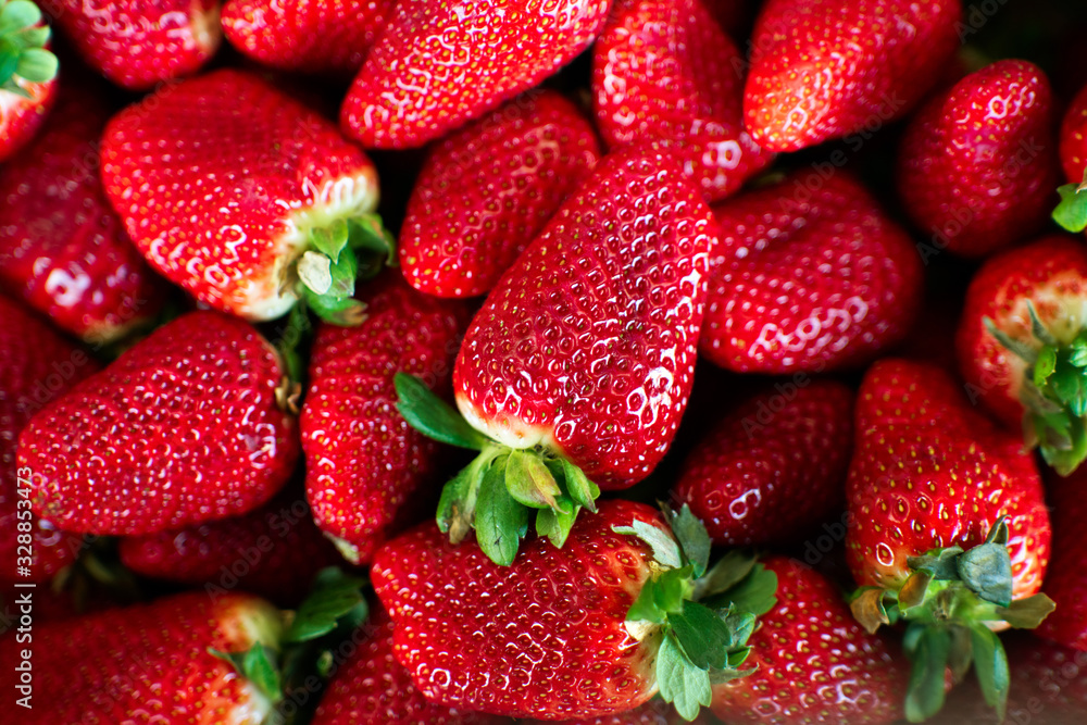 Strawberry. Fresh and ripe organic Strawberries Background, Vegetarian healthy food backdrop. Close-