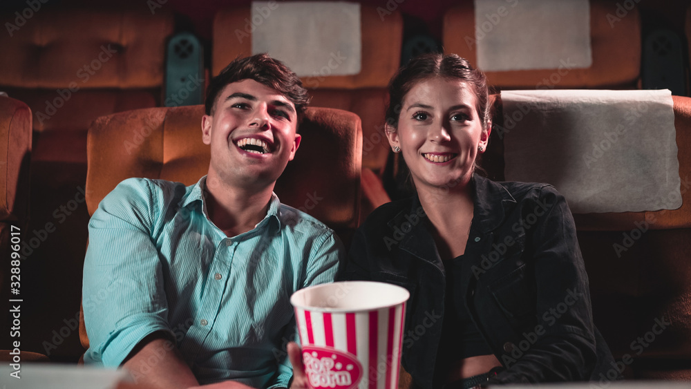 People audience watching movie in the movie theater cinema. Group recreation activity and entertainm