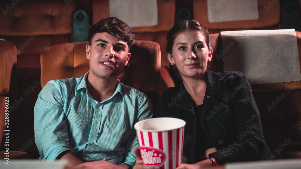 People audience watching movie in the movie theater cinema. Group recreation activity and entertainm