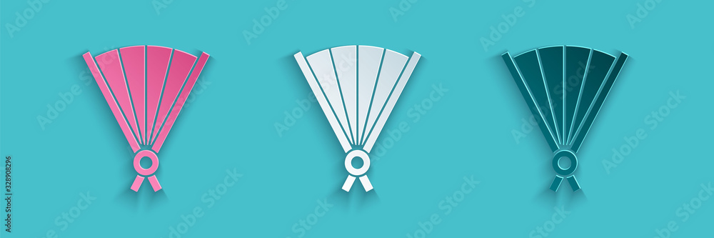 Paper cut Traditional paper chinese or japanese folding fan icon isolated on blue background. Paper 