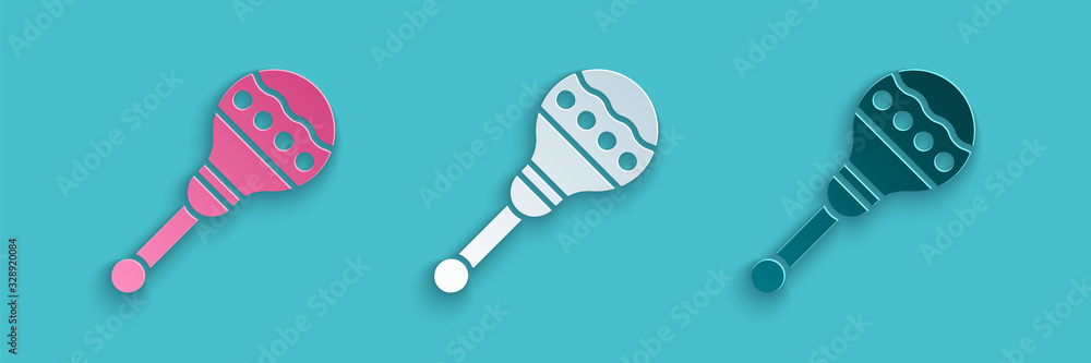 Paper cut Maracas icon isolated on blue background. Music maracas instrument mexico. Paper art style