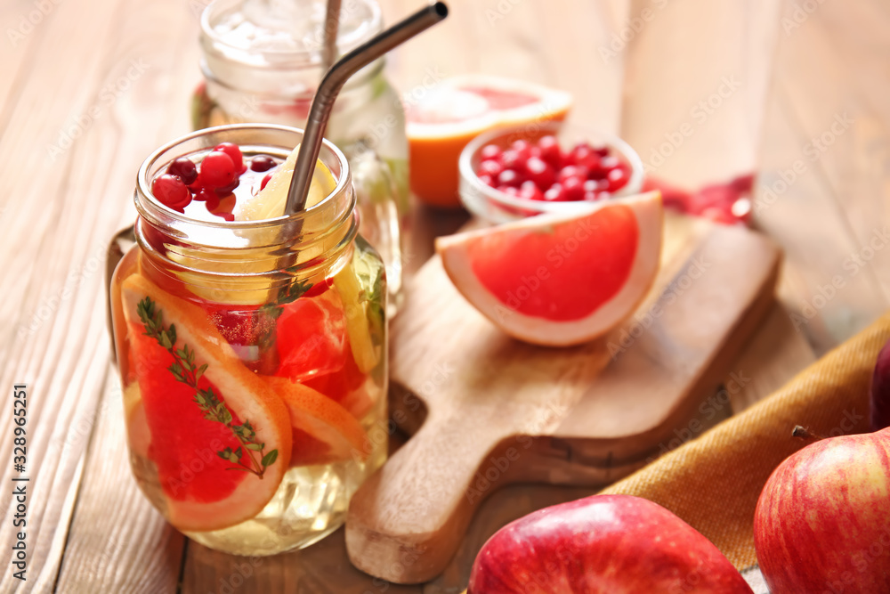 Mason jar of cold tea on wooden table