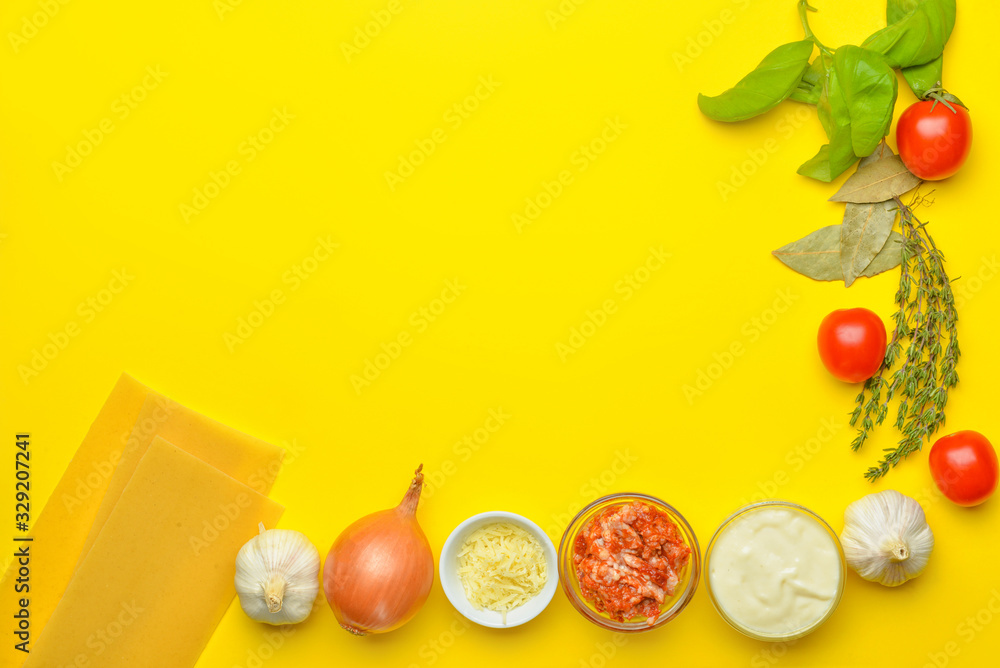 Ingredients for lasagna on color background