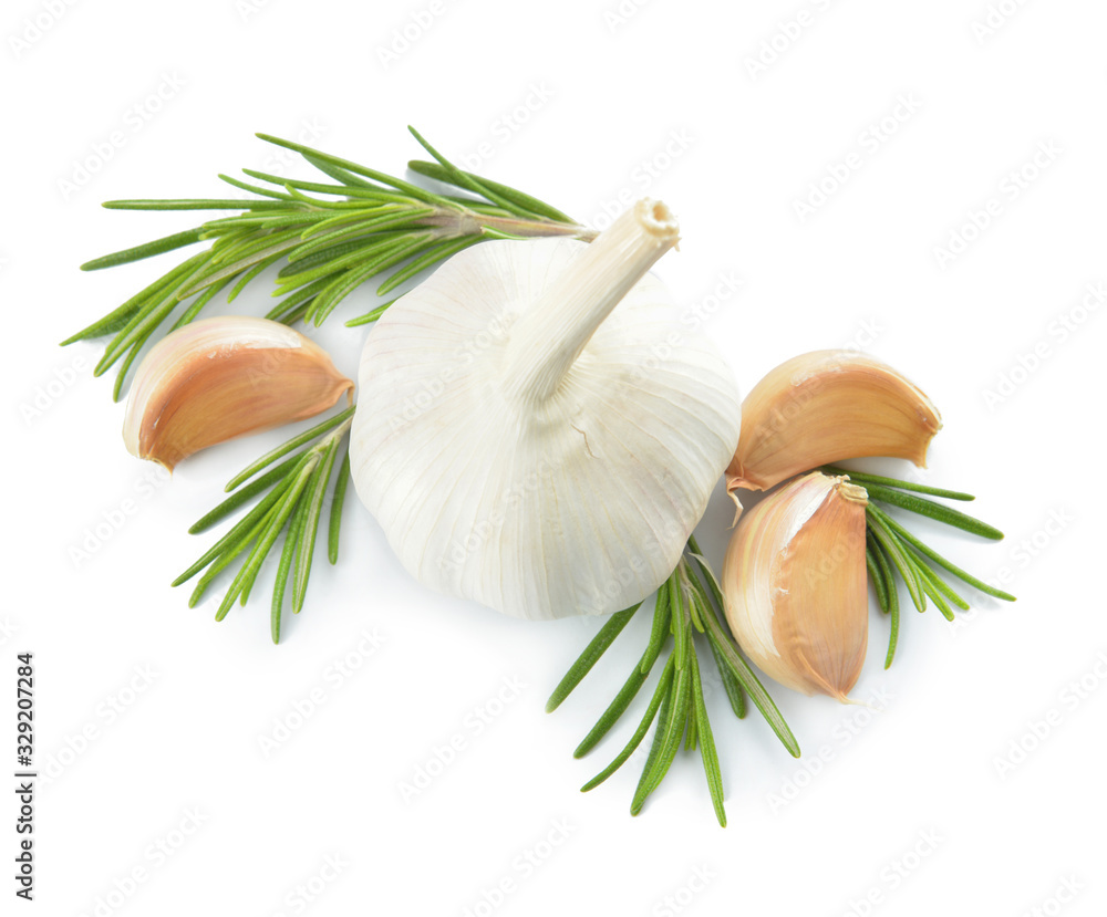 Fresh garlic with herbs on white background