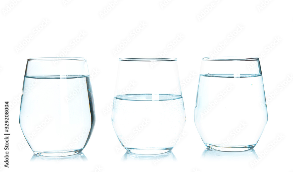 Glasses of fresh water on white background