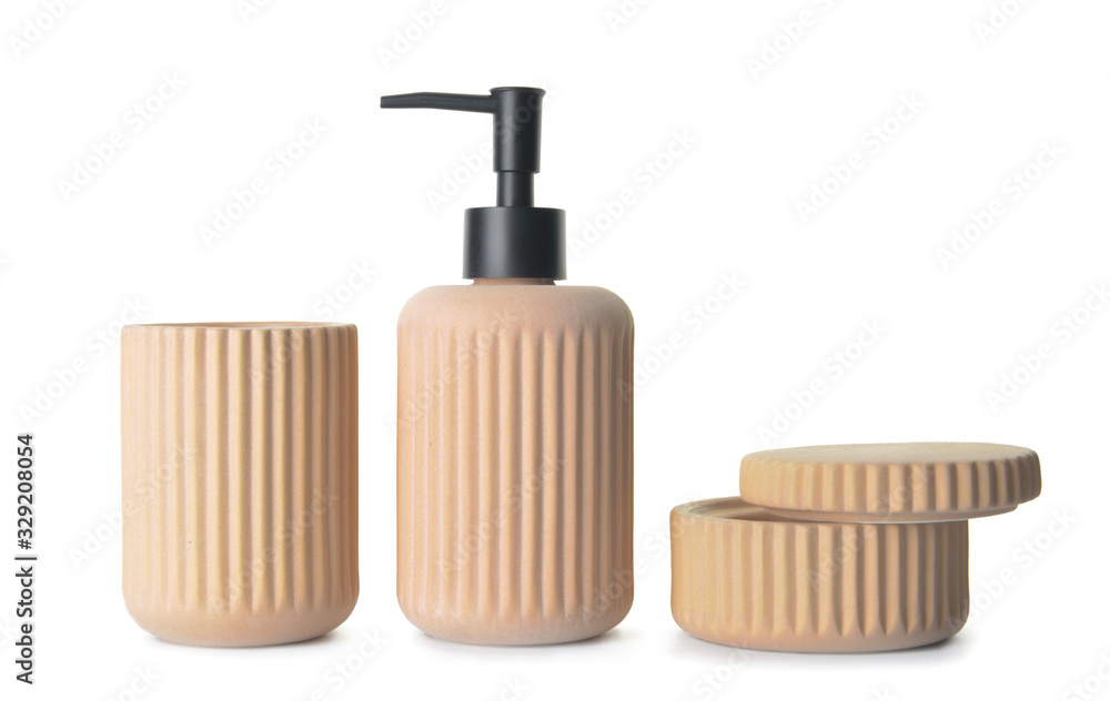 Containers for soap and toothbrushes on white background