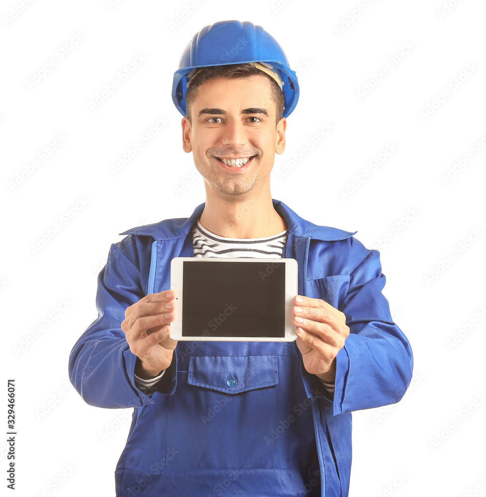 Handsome male worker with tablet computer on white background