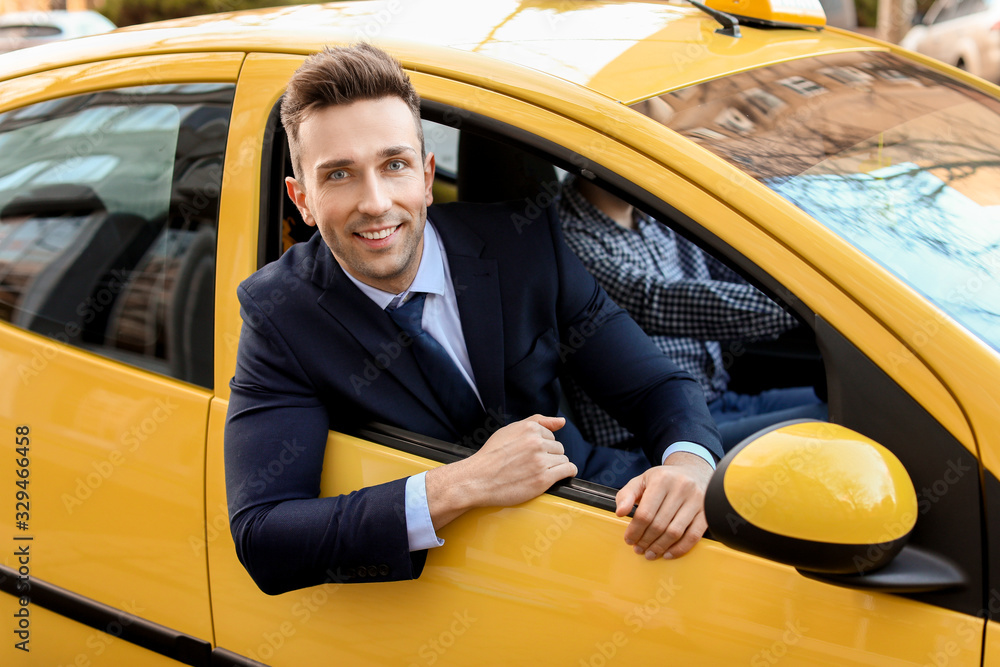 Businessman looking out of taxi window