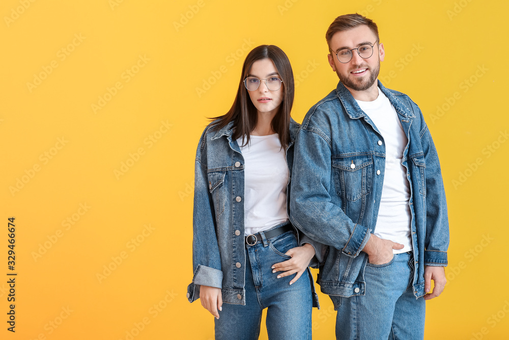 Stylish friends on color background