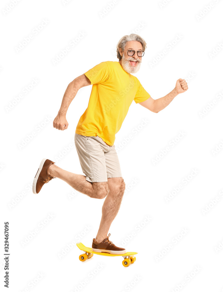 Happy elderly man with skateboard on white background