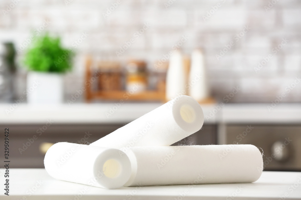 Clean water filters on table in kitchen