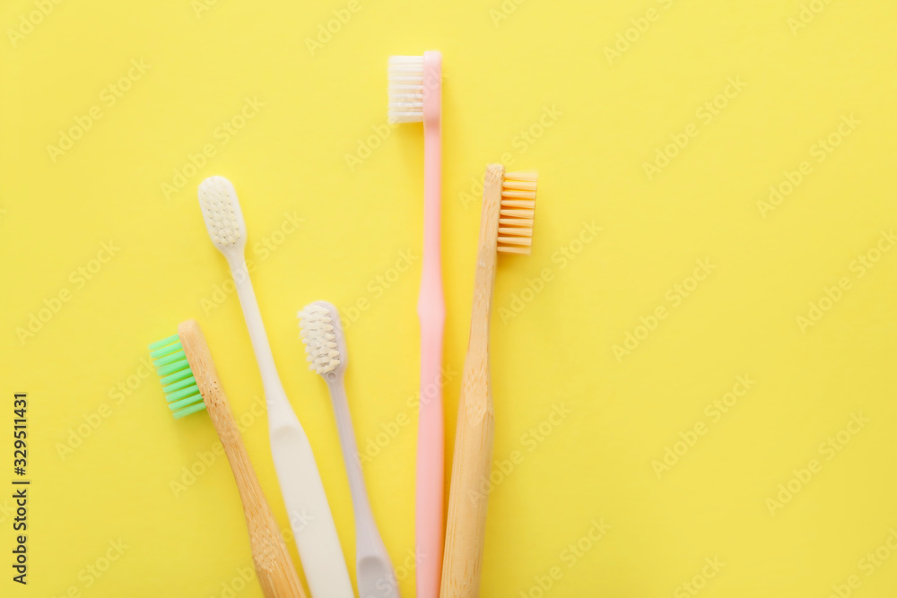 Tooth brushes on color background