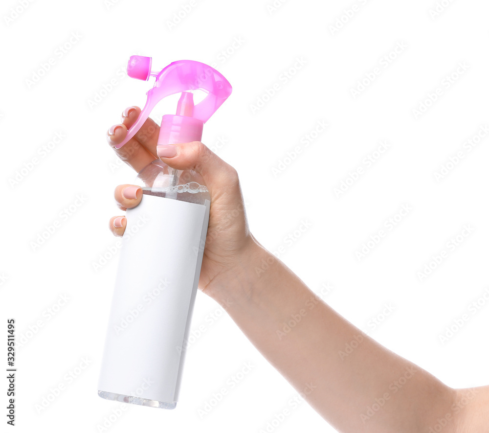 Female hand with air freshener on white background