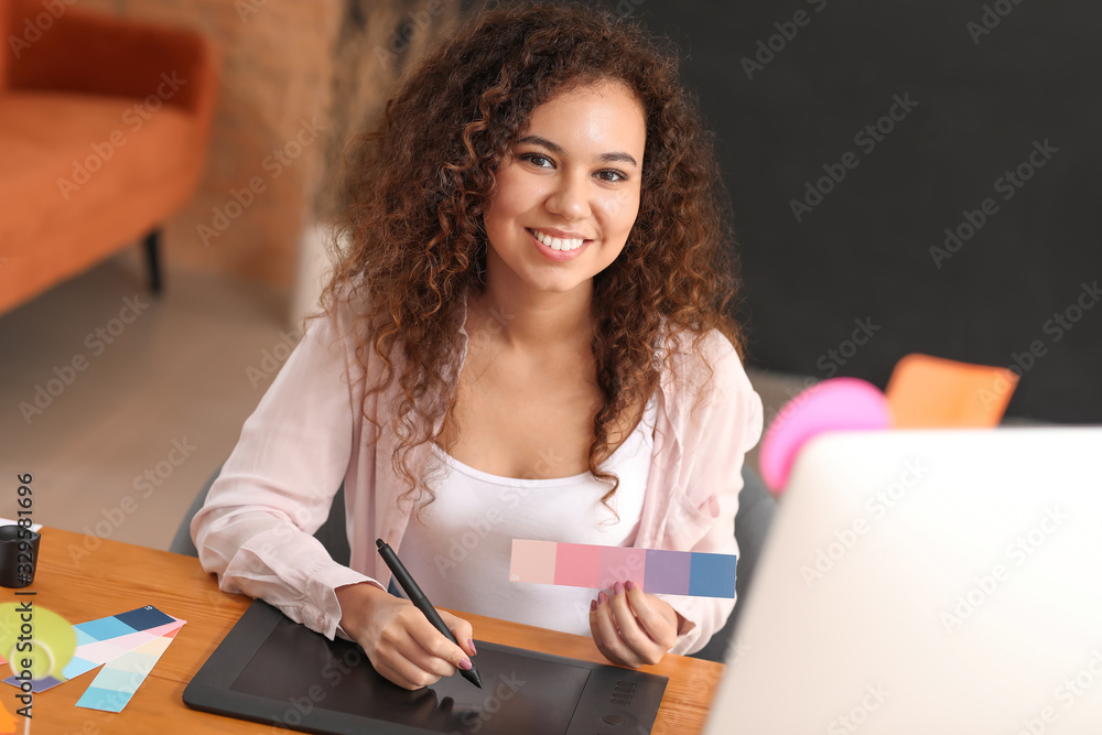 African-American designer working in office