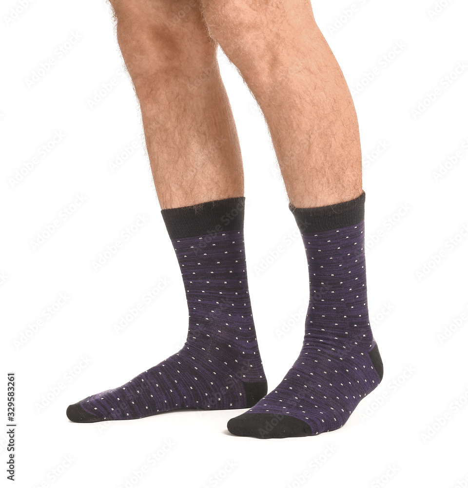 Male legs in socks on white background