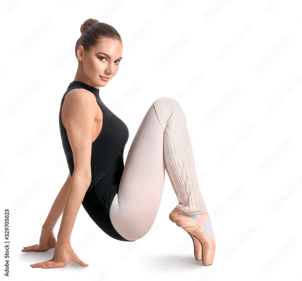 Beautiful young ballerina on white background