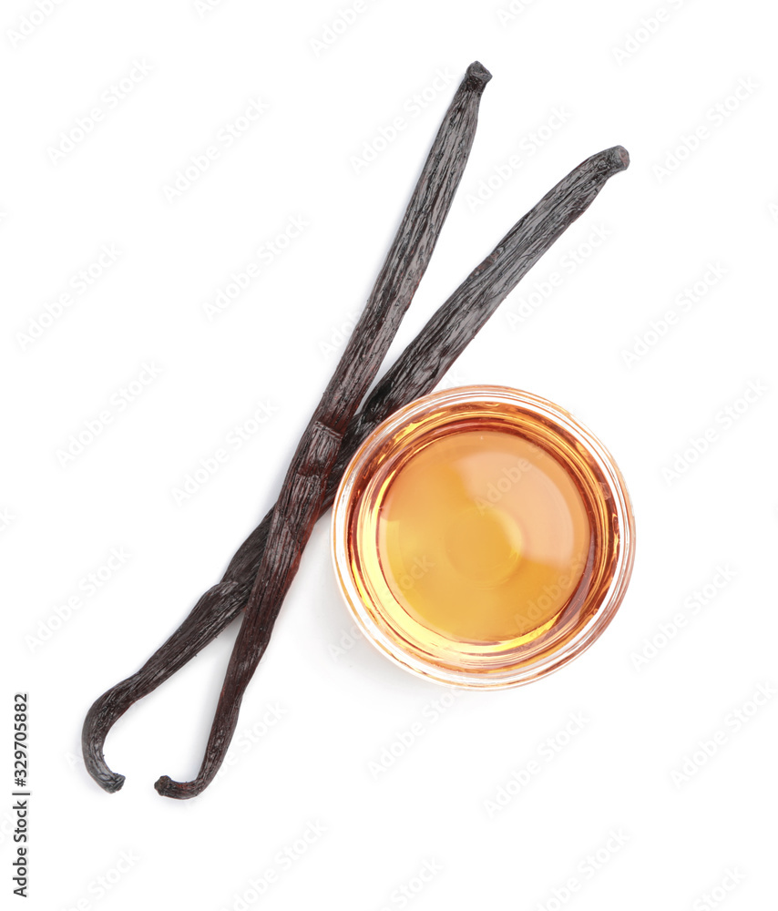 Bowl with vanilla extract on white background