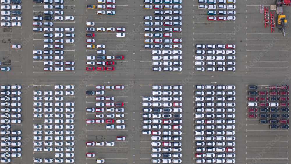 Car Dealer Logistics Center, new cars parked. Drone view.