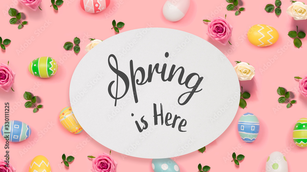 Spring is here message with Easter eggs on a pink background