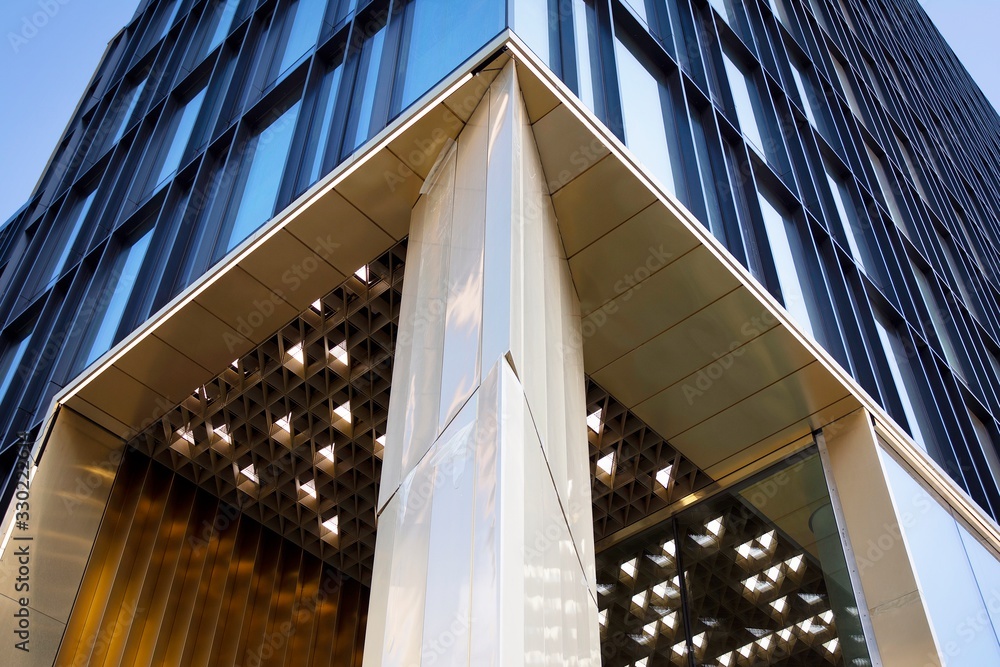 Modern office building facade abstract fragment, shiny windows in steel structure