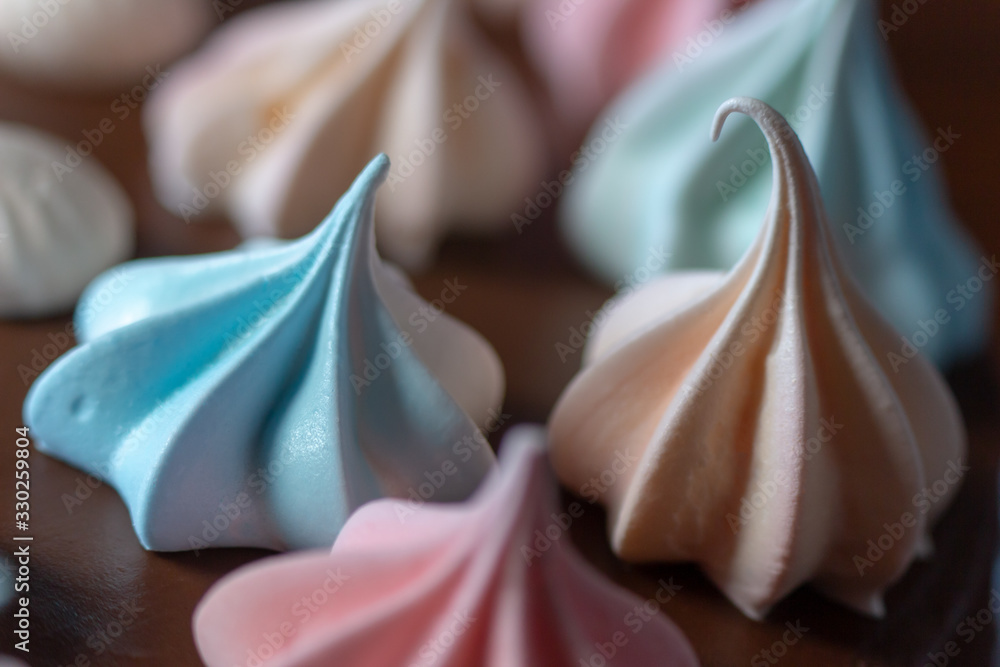 colored meringues on top of the cake