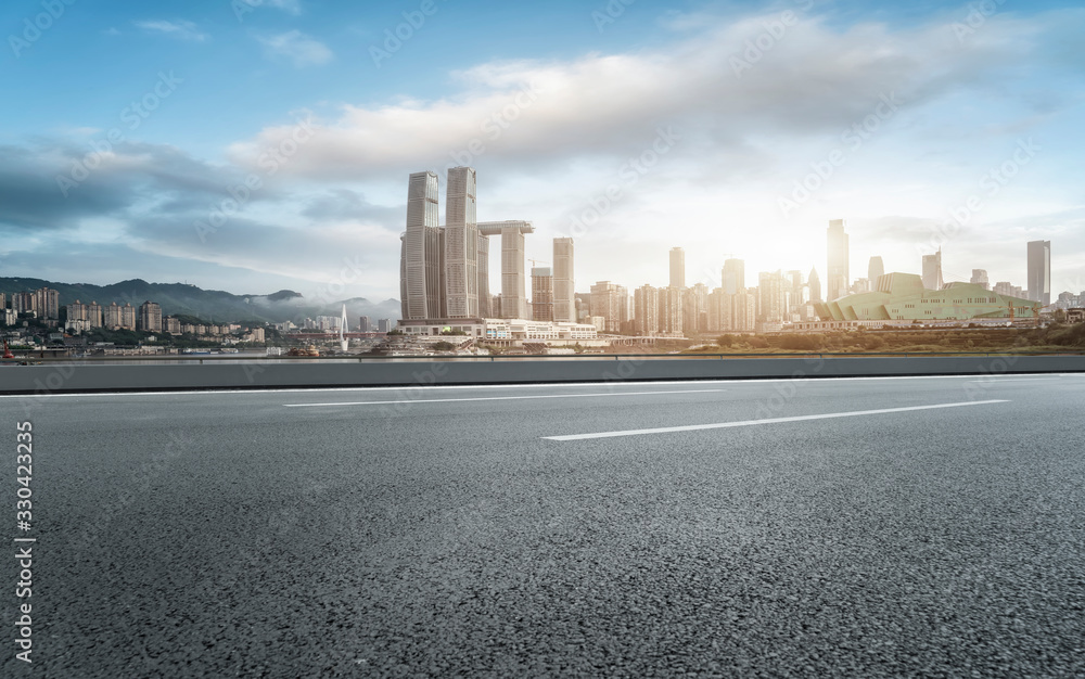 Road surface and urban building skyline..