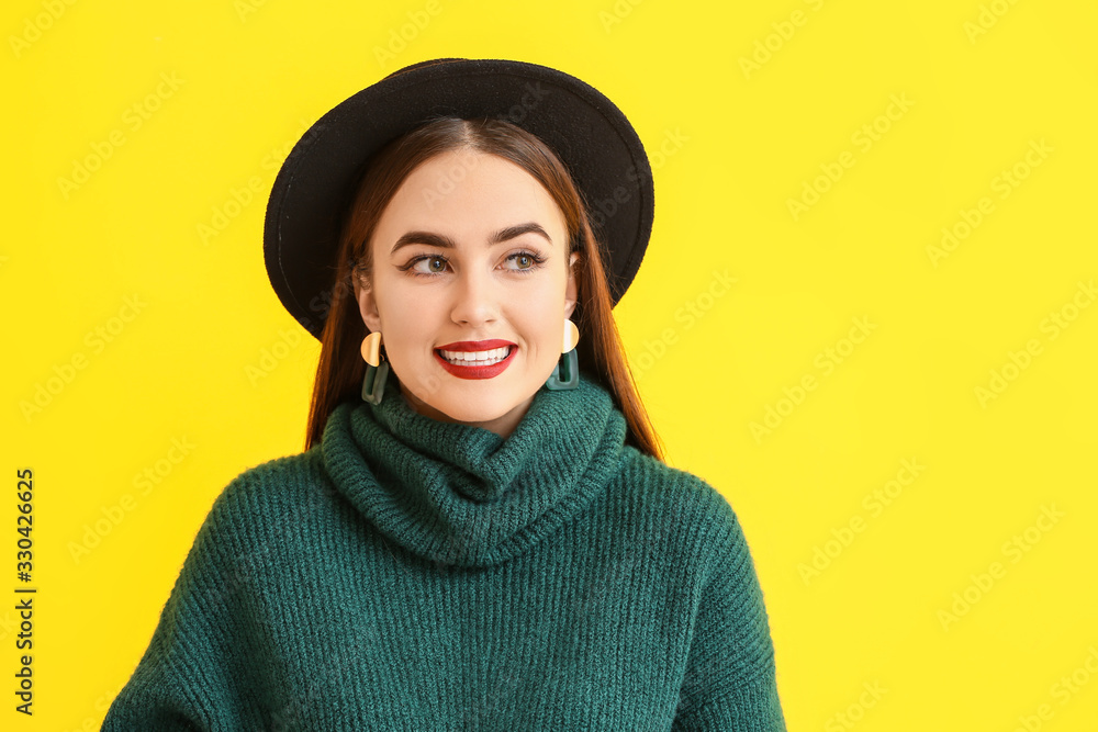 Beautiful young woman on color background