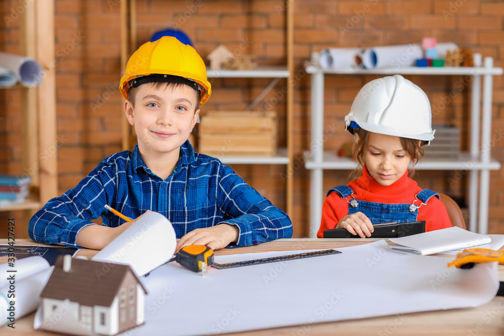 Cute little architects in office