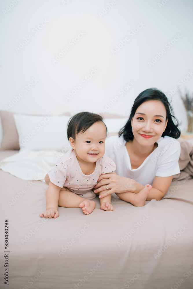 Cute little girl sitting in a room. Child have fun at home.