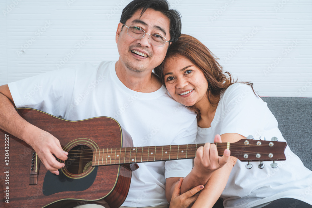 Happy Asian senior couple having good time at home. Old people retirement and healthy citizens elder